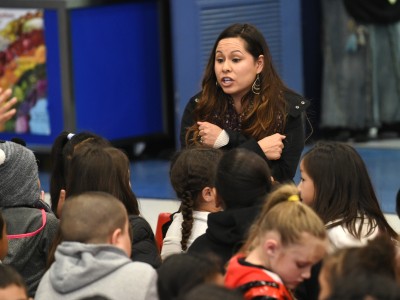Jessica Villanueva with students before assembly