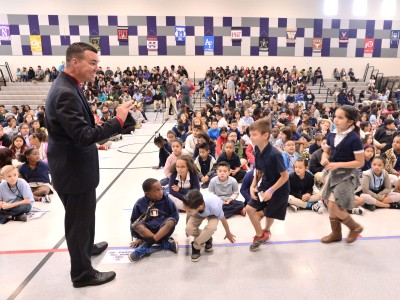 Timothy Thomas with students before assembly