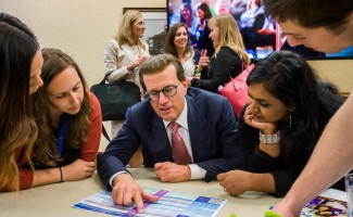 Lowell Milken helps Milken Educators choose panels MEA Forum 0324 1000w