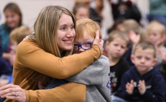 Meadowlark Jessica Kavitz student hug 1000w