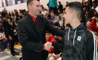 Rogers Ranch student congratulates Timothy Thomas 1000w