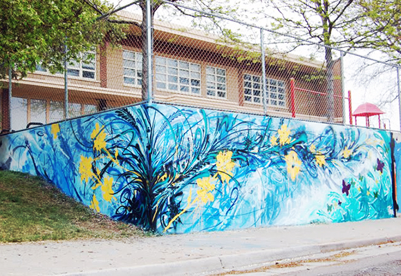 The finished fine arts mural Brown completed in collaboration with Guerilla Garden artist Jolt, funded by Denver’s Urban Arts Fund.
