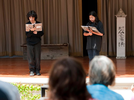 Students tell the audience about Ralph Lazo and his decision to join his Japanese and Japanese-American friends in an internment camp during World War II.
