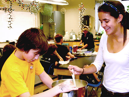 Students participate in the Cheese Making Workshop at the school’s Second Annual Fall Harvest Celebration in 2010. The event features a 100 percent local meal, plus performances by students and faculty.