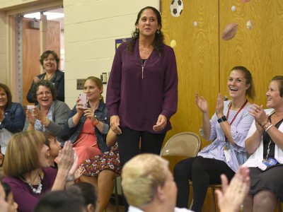 Aimee Schade surrounded by colleagues