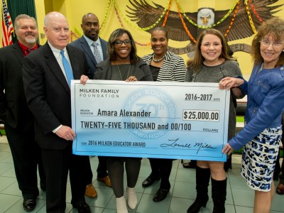 Amara Alexander check with dignitaries