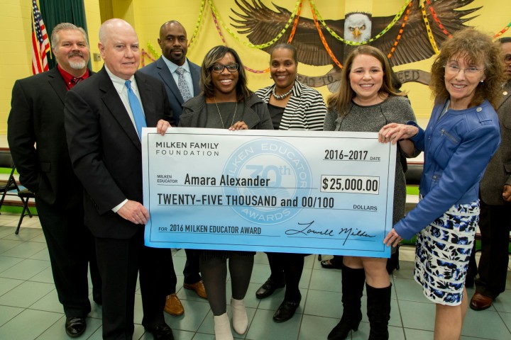 Amara Alexander check with dignitaries