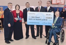 Amber Simpson check with dignitaries