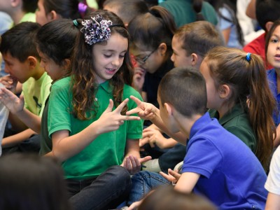 Amy Biehl students rock paper scissors