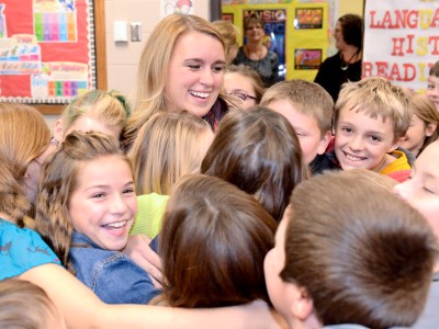 Angela Harvala hugged by students