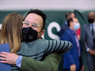 BFHS Jay Weisman hugs colleague