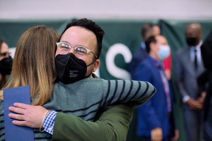 BFHS Jay Weisman hugs colleague