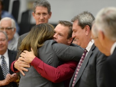 Bill Smithyman hugs Principal Amy Murphy