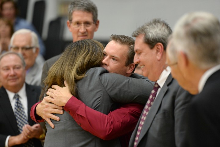 Bill Smithyman hugs Principal Amy Murphy