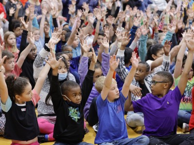 Black Fox students hands up