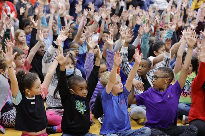 Black Fox students hands up