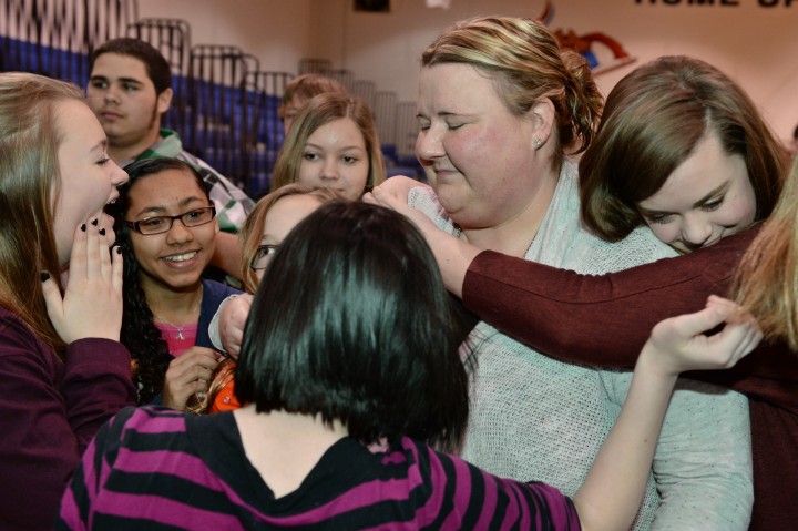 Bode Middle hug from students