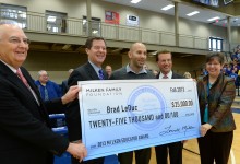 Brad LeDuc Lowell Milken and VIPs with check