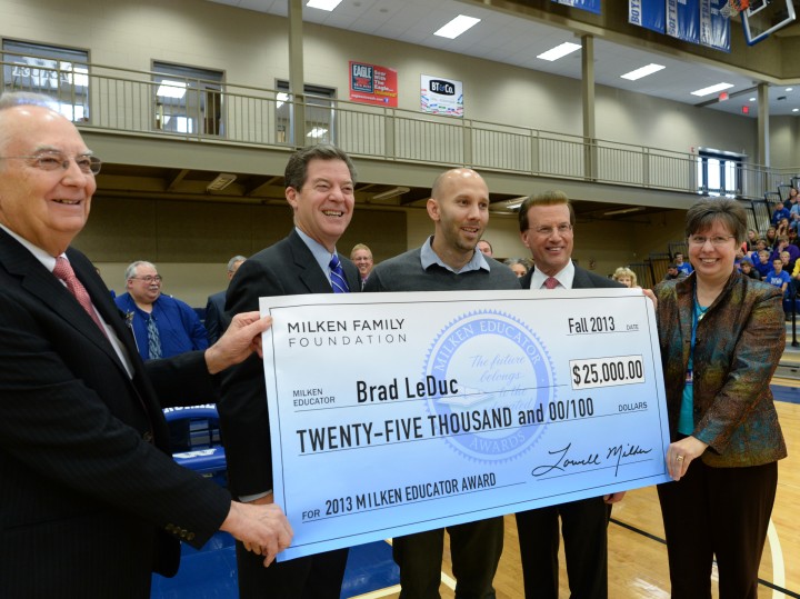 Brad LeDuc Lowell Milken and VIPs with check