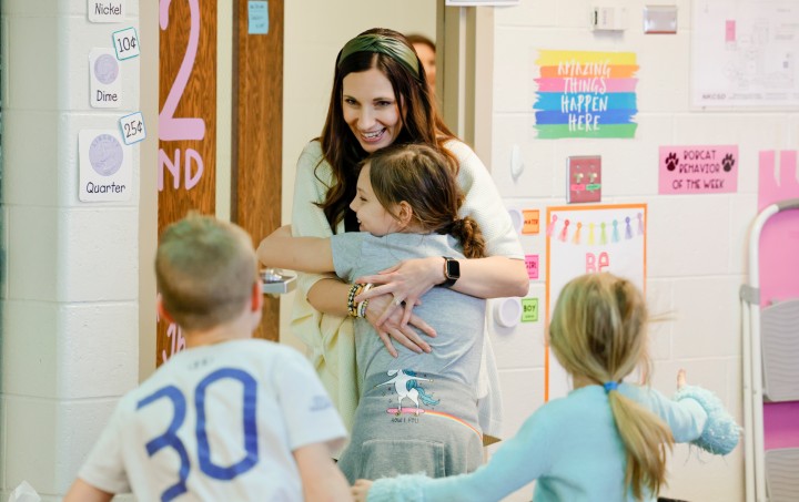 CHES Vanessa Thomson students hug