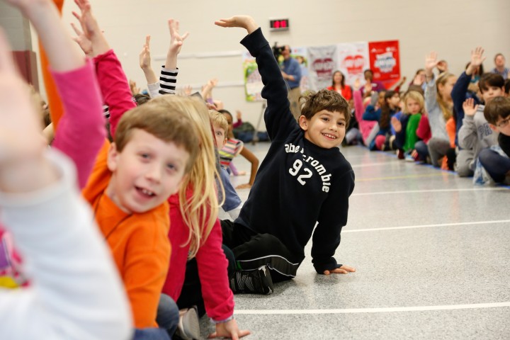 Carman McBride Students raise their hands