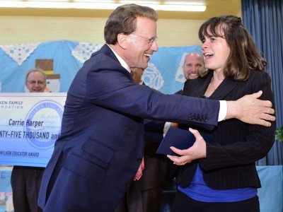 Carrie Harper greeted by Lowell Milken