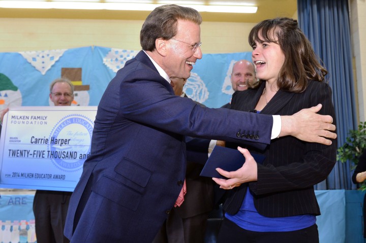 Carrie Harper greeted by Lowell Milken