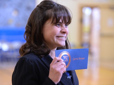 Carrie Harper with Milken Educator envelope