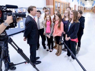 Christal Bookhamer Lowell Milken interviews students