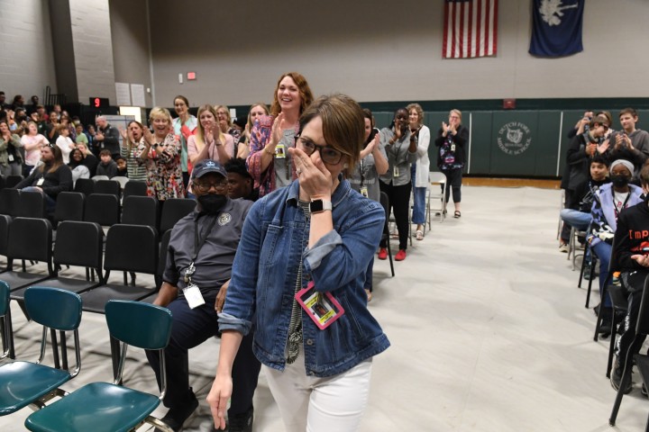 DFMS Lesley Snyder walks to front