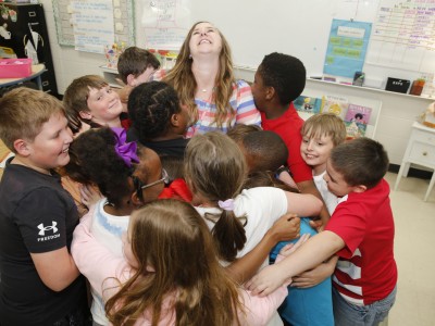 Drew Emily Howard students hug