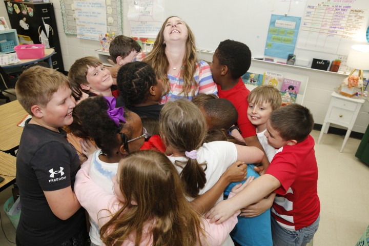 Drew Emily Howard students hug