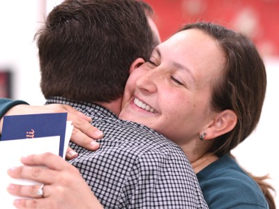 Emily Caldarelli hugs colleague