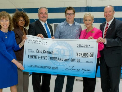 Eric Crouch check with dignitaries