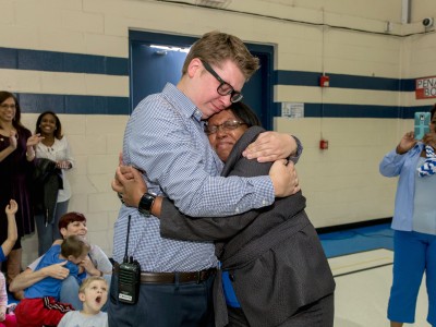 Eric Crouch hugs principal