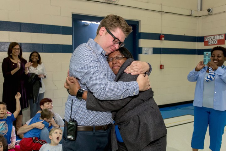 Eric Crouch hugs principal