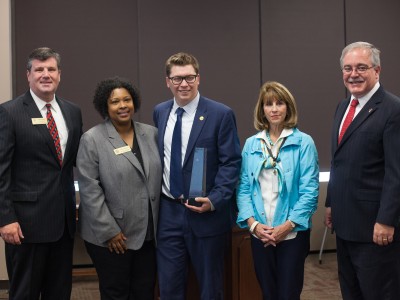 Eric Crouch obelisk presentation with dignitaries