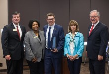 Eric Crouch obelisk presentation with dignitaries
