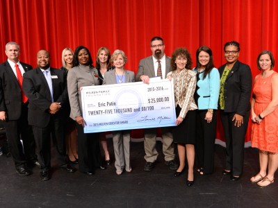 Eric Patin with Milken Award check