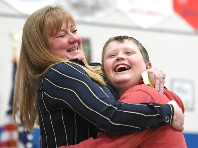 Felicia Casto hugs Rim Rock student