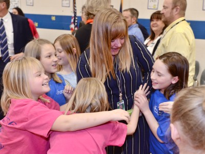 Felicia Casto hugs from students