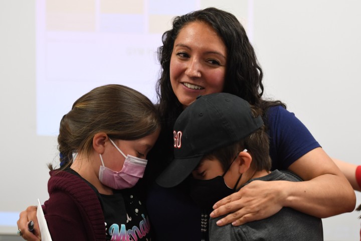 Gonzales Gabrielle Kahawai hugs students