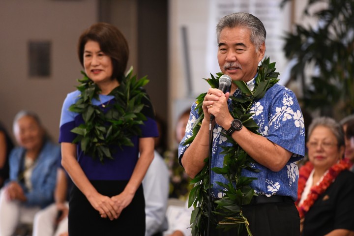 Governor David Ige congratulates Kelly Sutcliffe