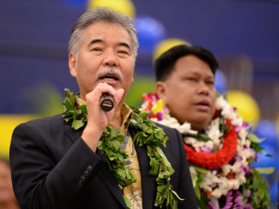 Governor David Ige congratulates Michael Sana