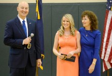 Governor Pete Ricketts and Jane Foley congratulate Courtney Matulka