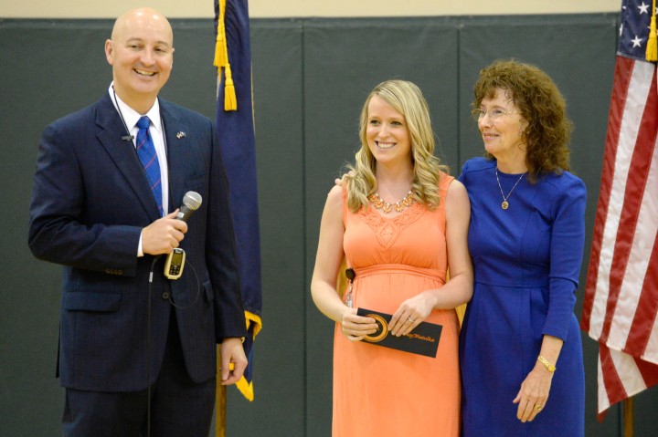 Governor Pete Ricketts and Jane Foley congratulate Courtney Matulka