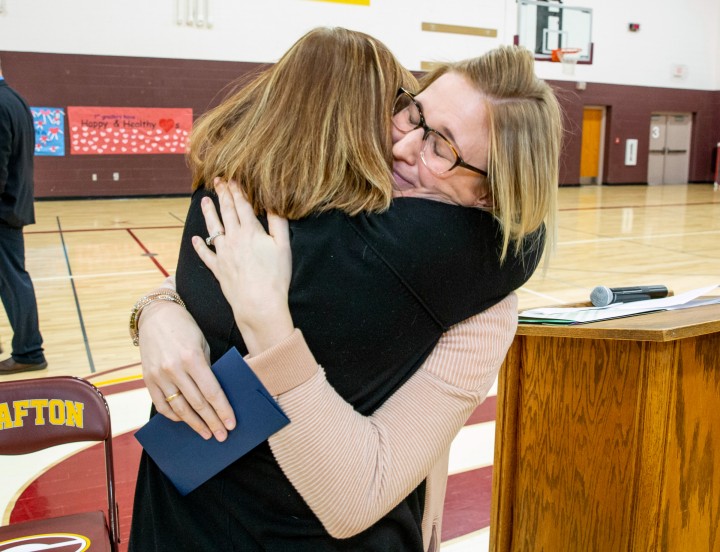 Grafton 2018 Brittany Larson colleague hug