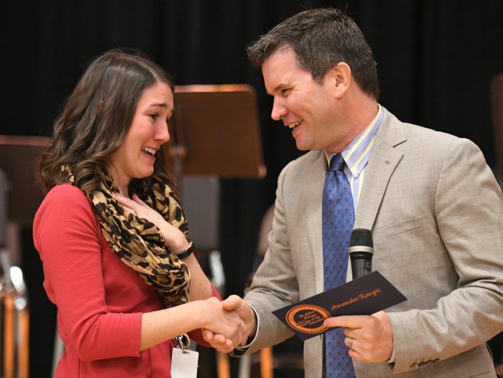 Greg Gallagher congratulates Amanda Raupe