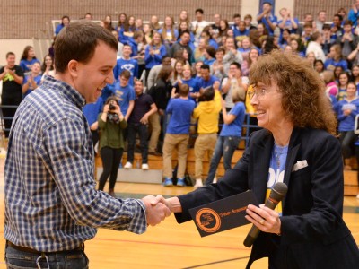 Jane Foley hands Peter Arseneault award