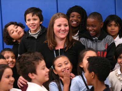 Jennie Schmaltz surrounded by students